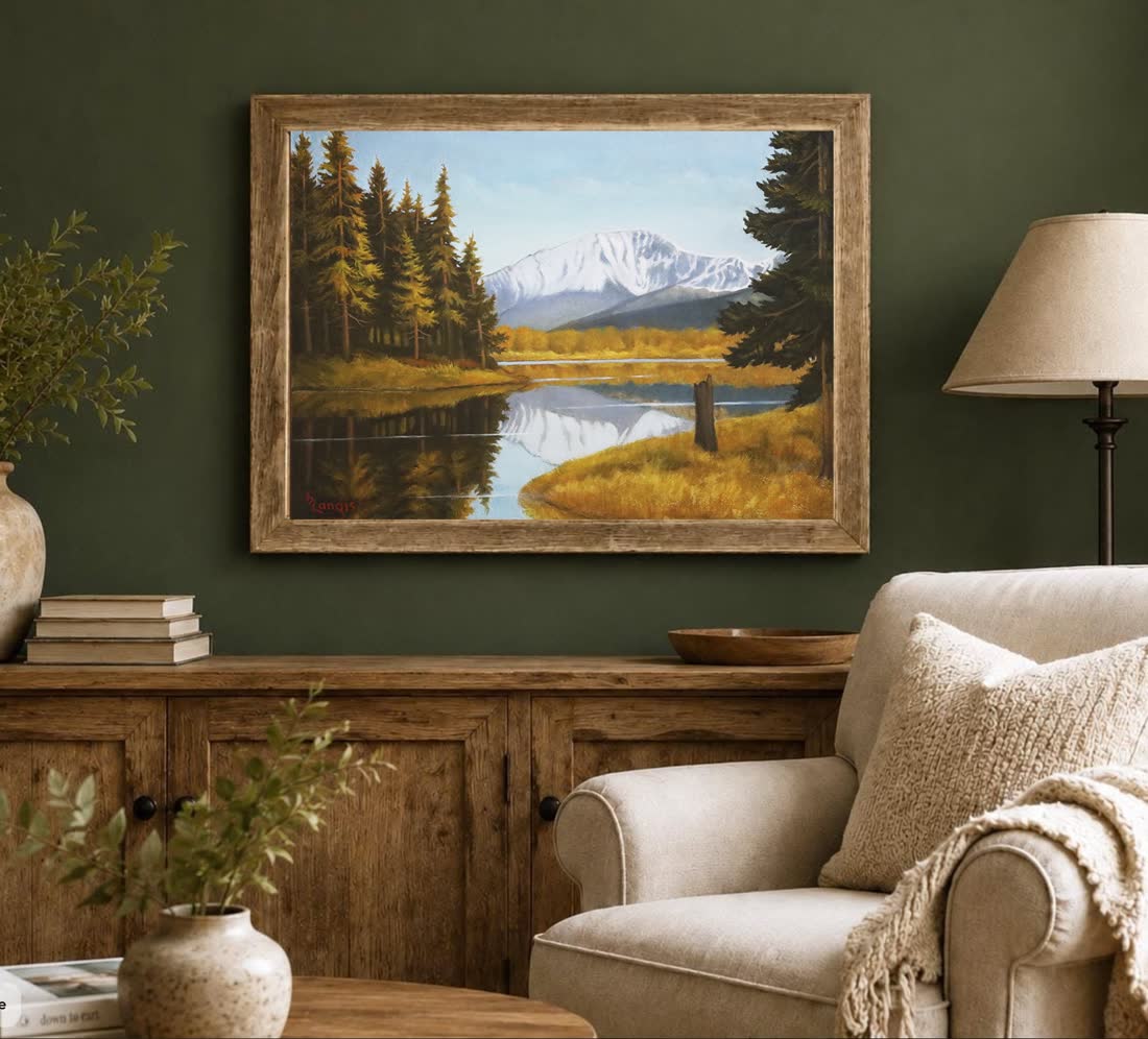 An original Bill Langis landscape painting hung in a furnished room